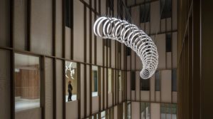“Loops” is a large-scale kinetic artwork by SpY permanently installed at the atrium of Inselspital, the largest hospital in Switzerland.